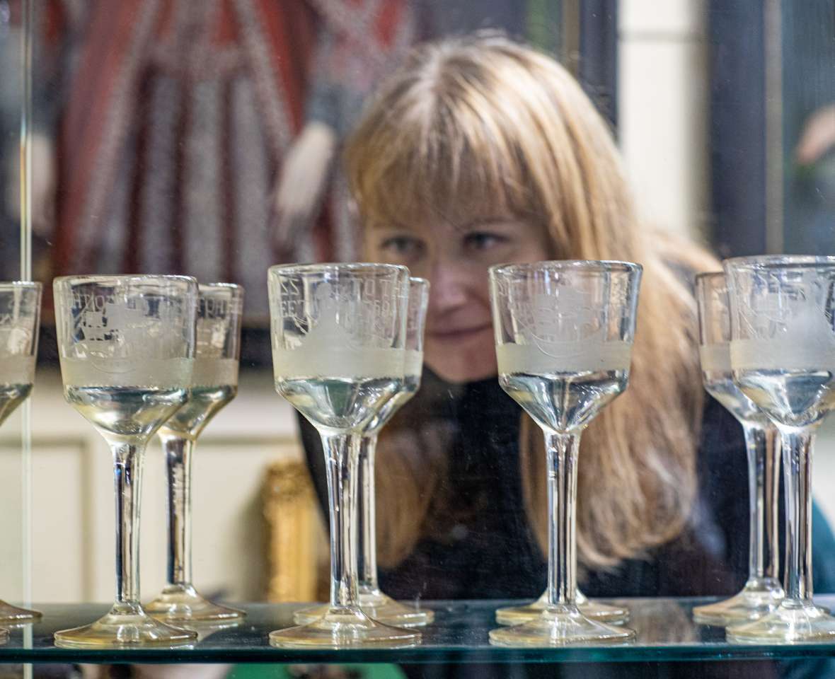 Woman looking at glass objects